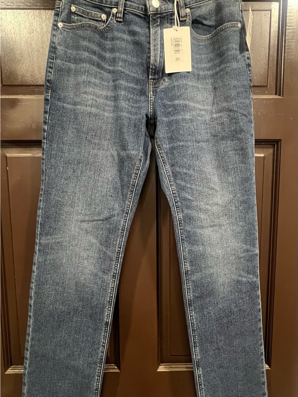 Frame Denim Slim Straight Jeans in Washed Blue.
